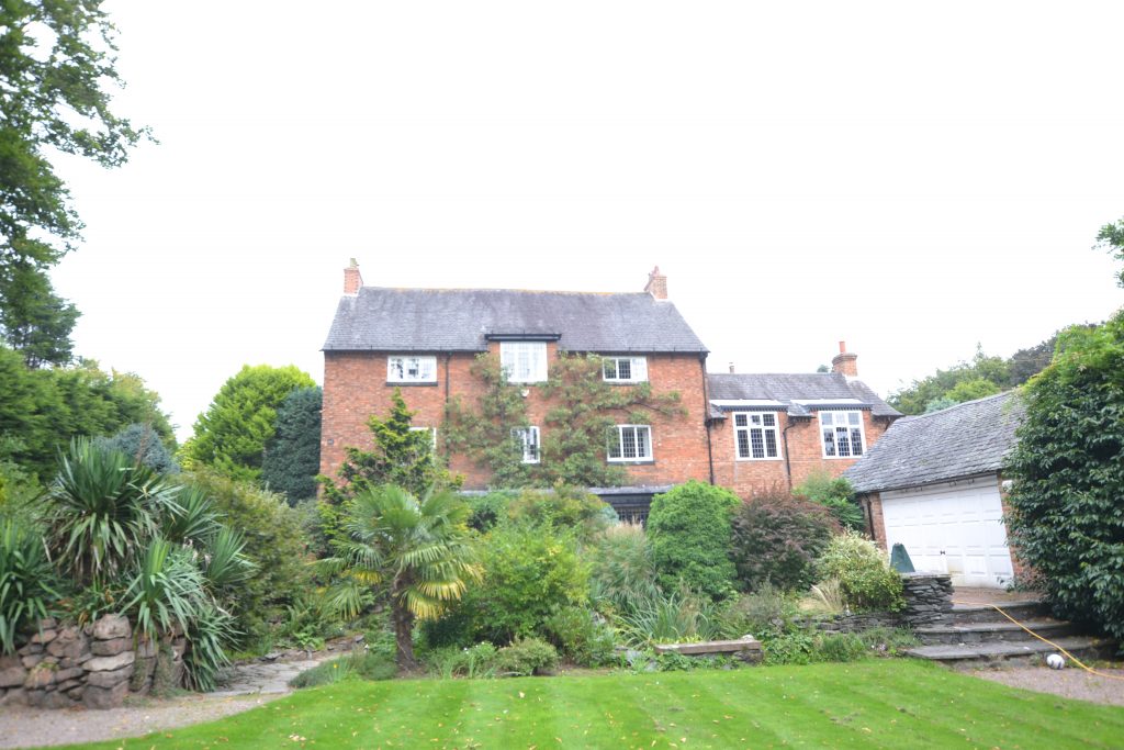 listed building with large garden